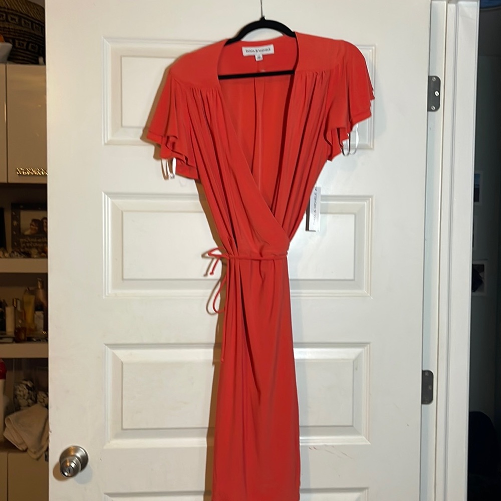 Orange wrap around slimming dress